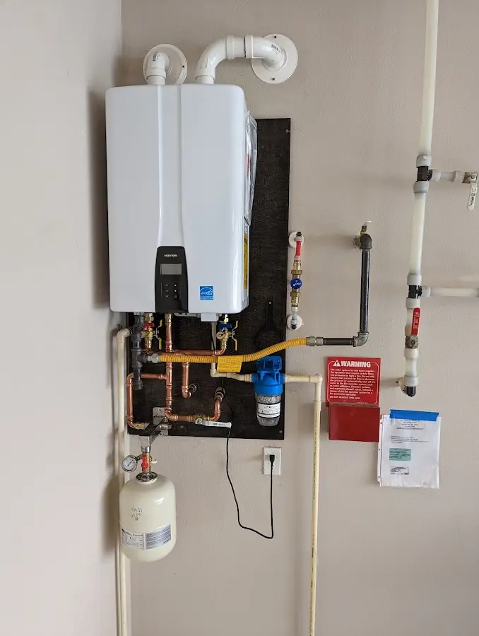 Professional plumber installing copper piping in a Kahului home
